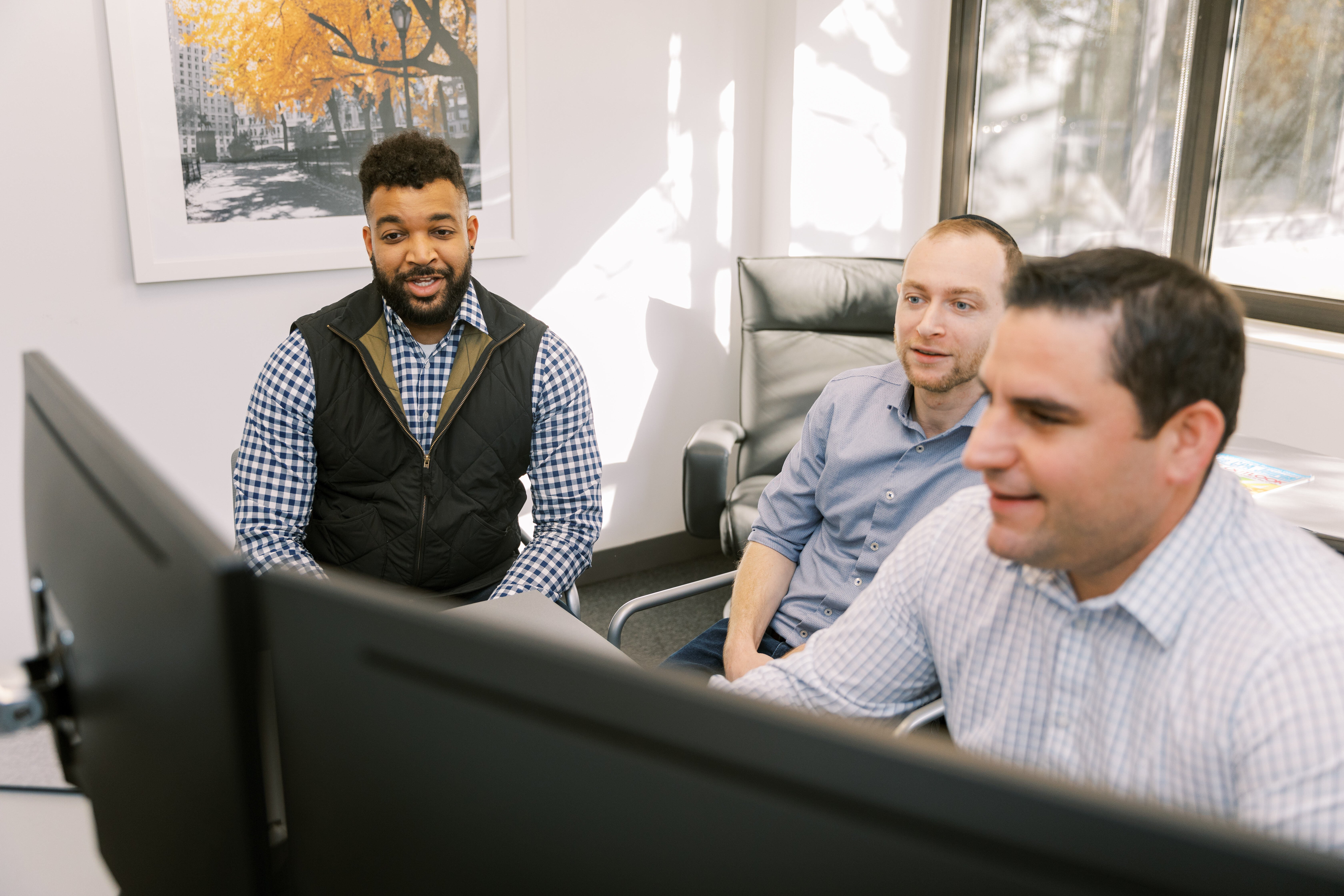 accountants looking at a screen